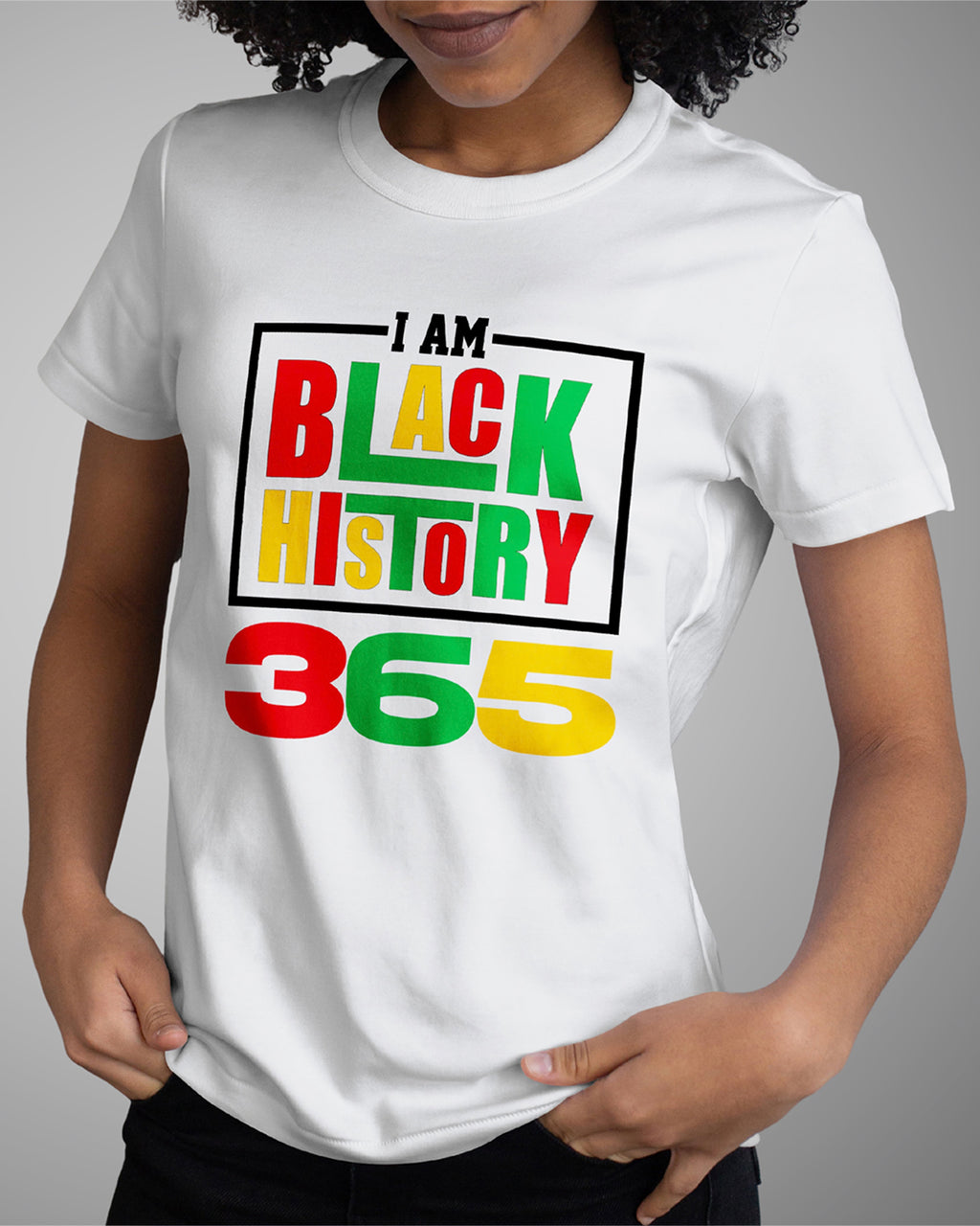 Person wearing a white t-shirt with 'I AM BLACK HISTORY 365' text in colorful letters on a gray background